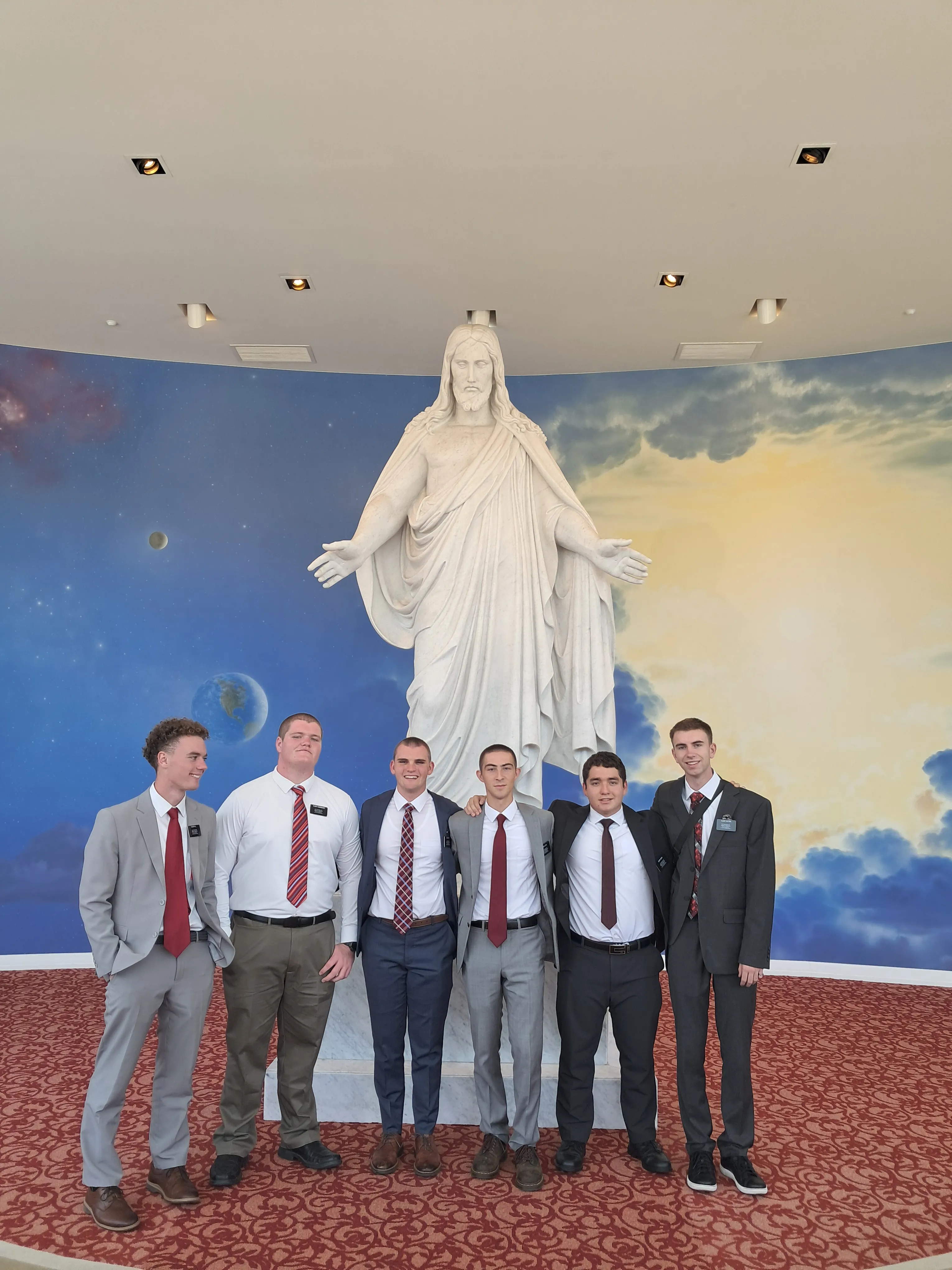 District missionaries with the Christus statue